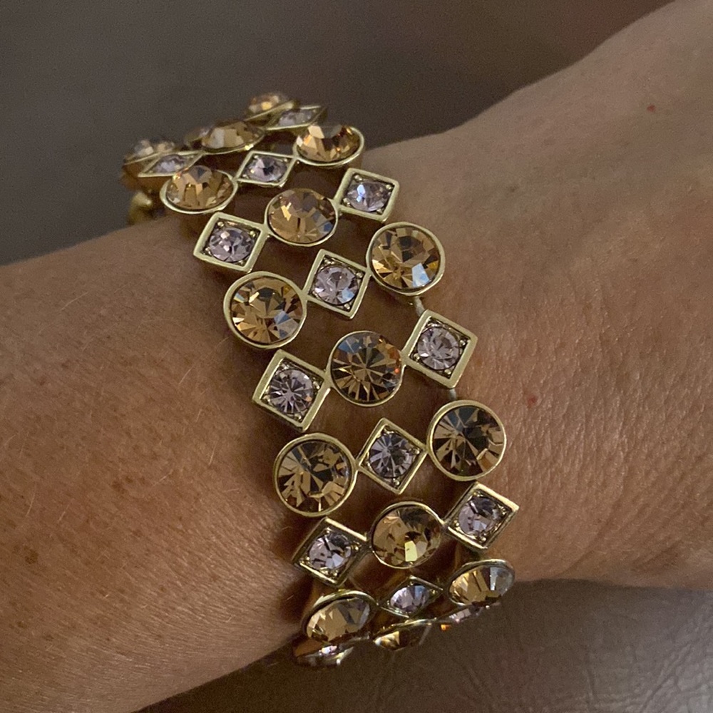 Gold Stretch bracelet with goldish brown and light pink stones.